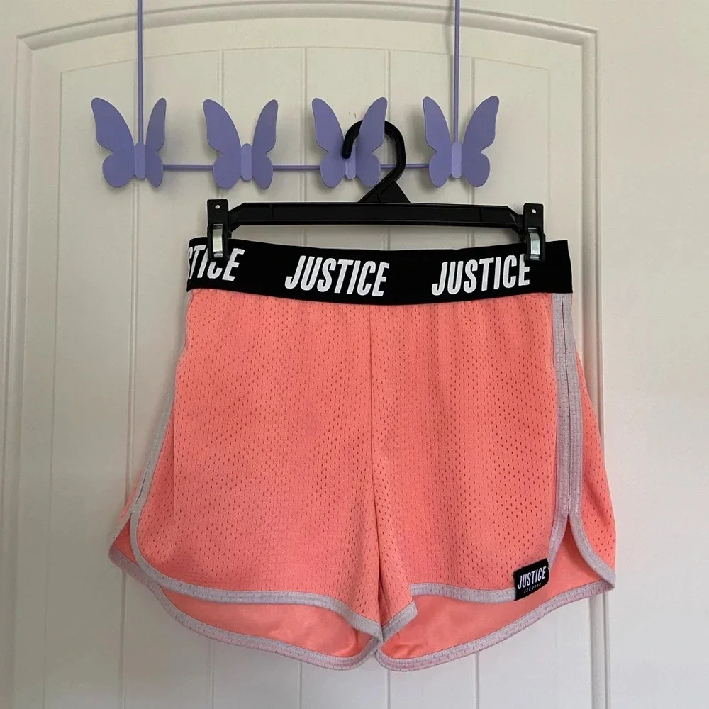 Justice girl’s peach athletic shorts — XL